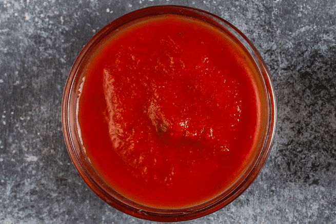Chicago mild sauce in a bowl on a dark surface.