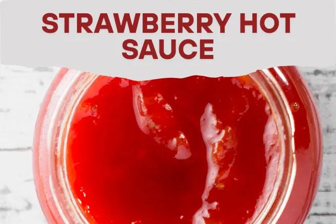 Strawberry Hot Sauce in a jar with a vibrant red hue, offering a perfect blend of sweet and spicy heat to enhance your dishes