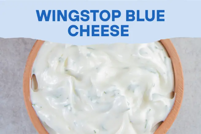 Authentic Wingstop blue cheese dip served in a wooden bowl with creamy texture and herbs