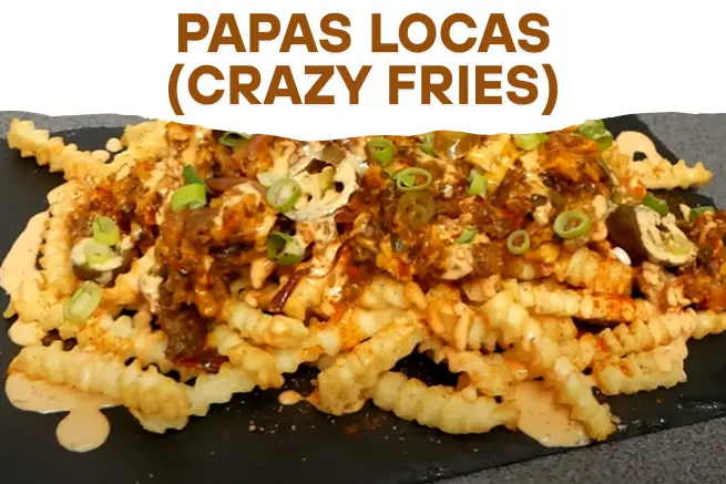 Delicious Papas Locas (Crazy Fries) topped with seasoned ground beef, creamy sauce, sliced jalapeños, and chopped green onions served on a black platter with bold text title.